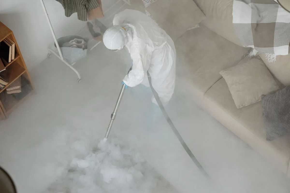 Biohazard cleanup technician in protective equipment, Little Chute, WI